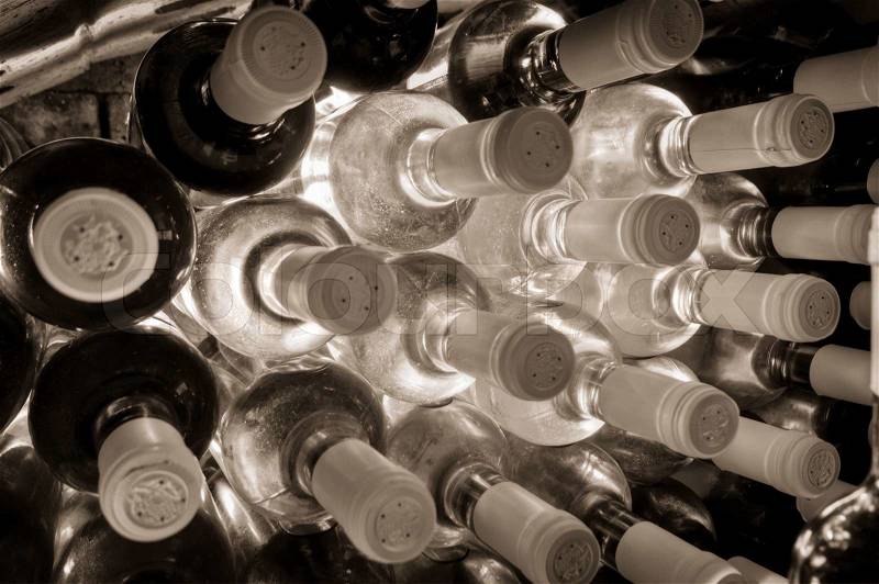 Stacked up wine bottles in the wine cave, stock photo