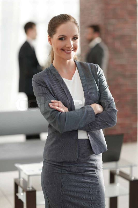 Woman employee of the company on the background of the office. photo with copy space, stock photo