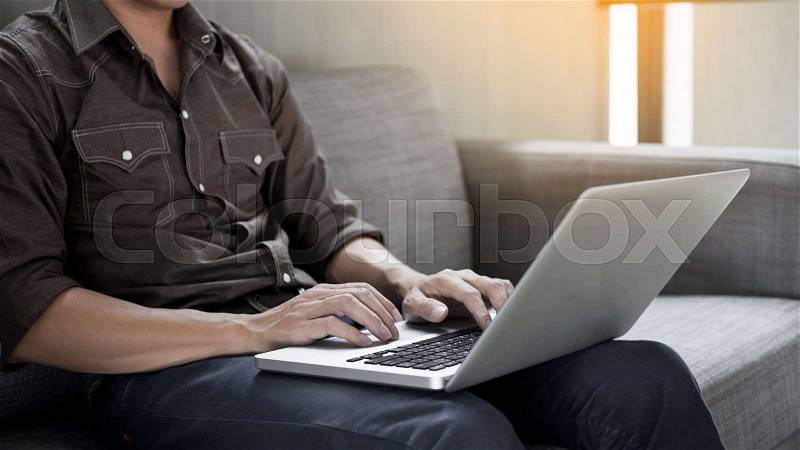 Businessman works on the sofa at home. Work searching for new idea creative and drinking hot coffee feeling think hard, stock photo