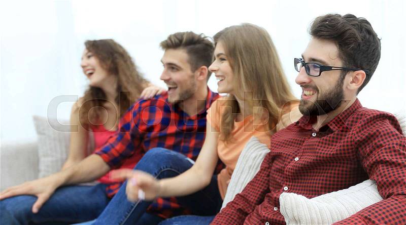 Group of smiling young people sitting on the couch. best friends, stock photo