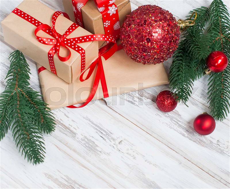 Merry Christmas gift boxes, fir branches, cones, Christmas decorations on the old wood table. Gift Magic christmas card, stock photo