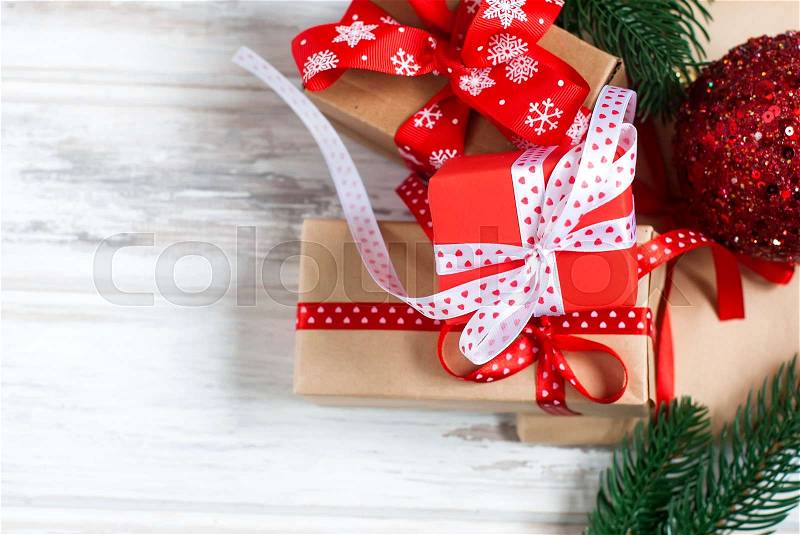 Merry Christmas gift boxes, fir branches, cones, Christmas decorations on the old wood table. Gift Magic christmas card, stock photo