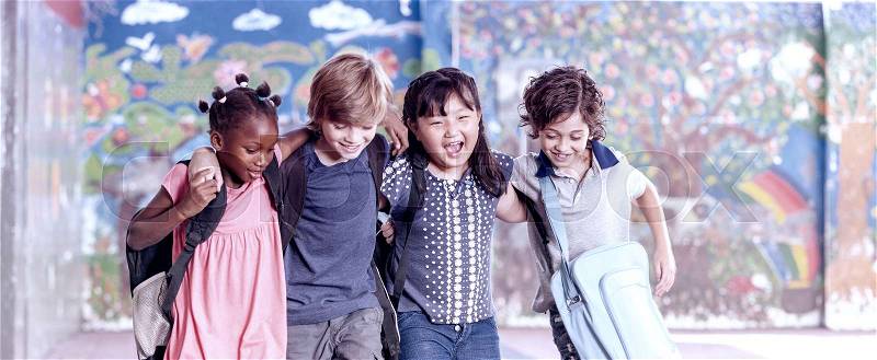 Multi ethnic group of children playing together. Success and integration concept, stock photo