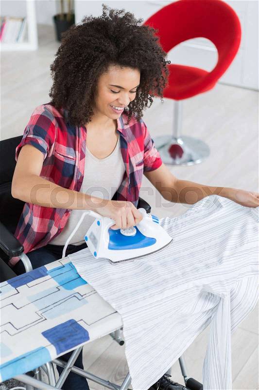 Ironing the clothing, stock photo