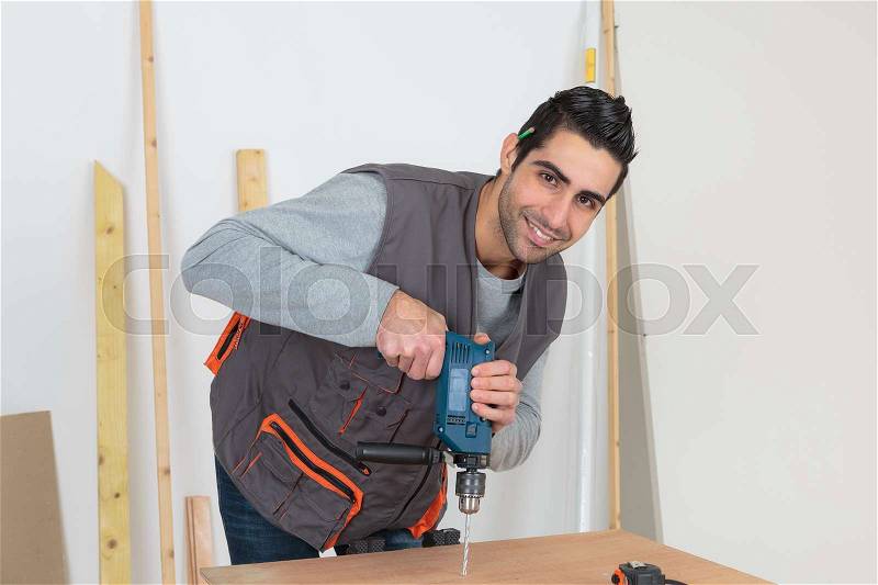The happy carpenter, stock photo