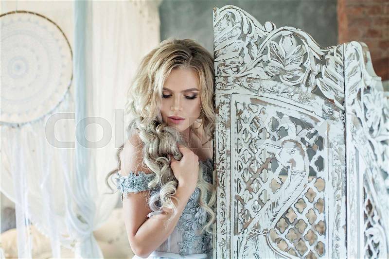 Nice Woman Model with Long Blonde Hair in Vintage Interior, stock photo