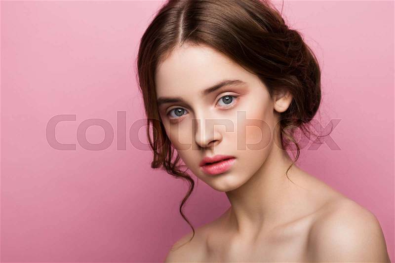 Beauty cute fashion model with natural make up on pink background, stock photo