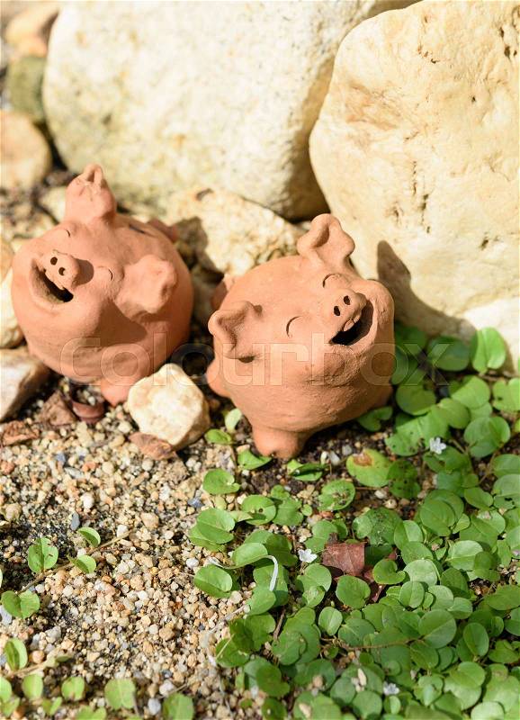 Piggy clay decorative in green garden outdoor,summer time, stock photo