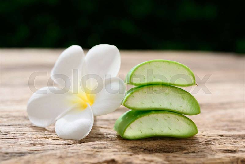 Fresh alo vera and plumeria spa flower on wooden background,spa treatment and body skin care concept, stock photo
