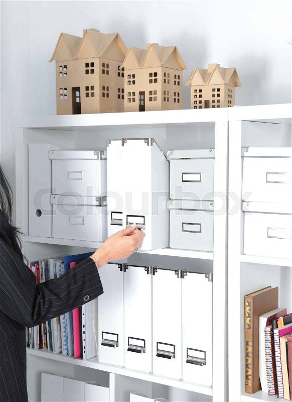 File folders, standing on shelves in the background, stock photo