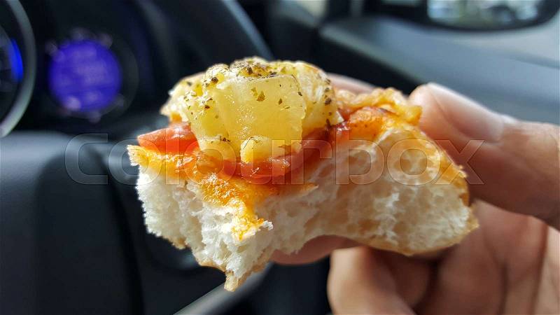 Eating in car, rush hour, stock photo