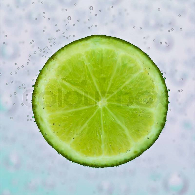 Slice of lime in the water, stock photo