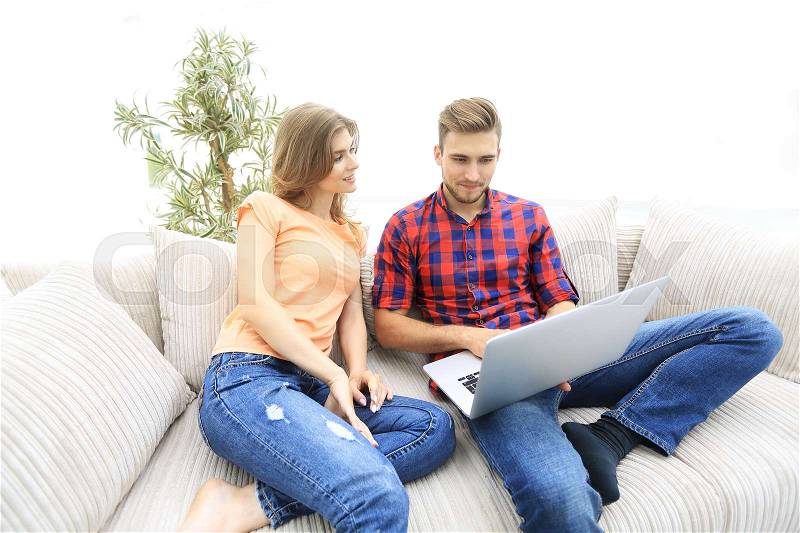 Happy modern couple surfing the net and working on laptop at home.photo with copy space, stock photo