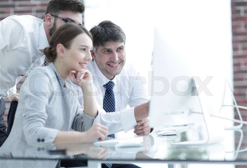 Business team discussing information sitting at the desk, stock photo