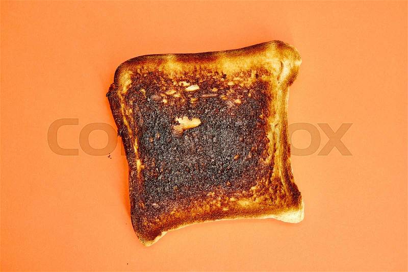 A studio photo of burnt toast, stock photo