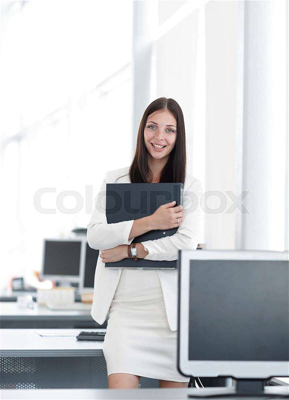 Female assistant with documents standing in the office.photo with copy space.photo with copy space, stock photo