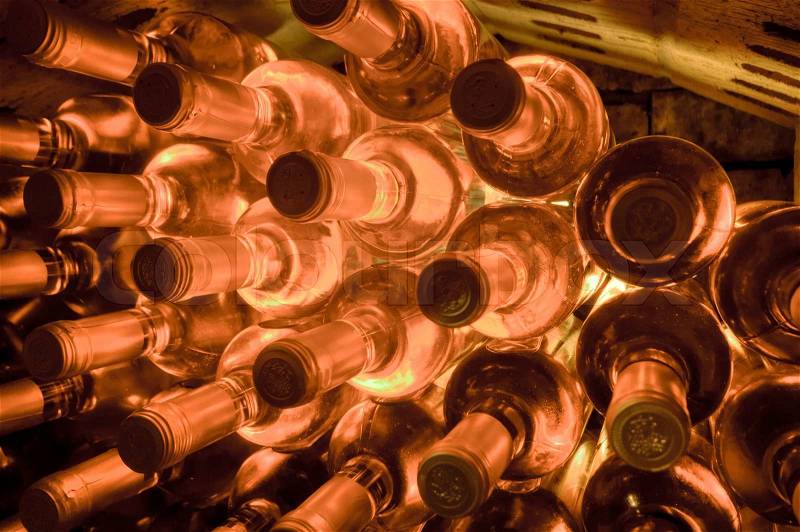 Stacked up wine bottles in the wine cave, stock photo