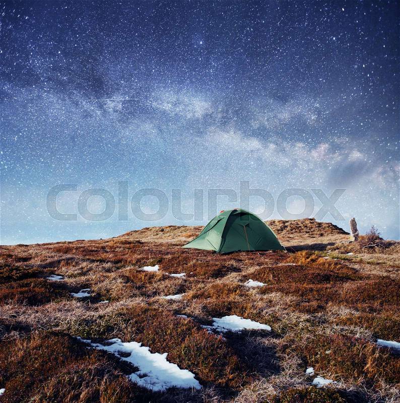 The starry sky above the tent in the mountains. Magic event in frosty day. In anticipation of the holiday. Dramatic scenes. Carpathians, Ukraine, Europe, stock photo