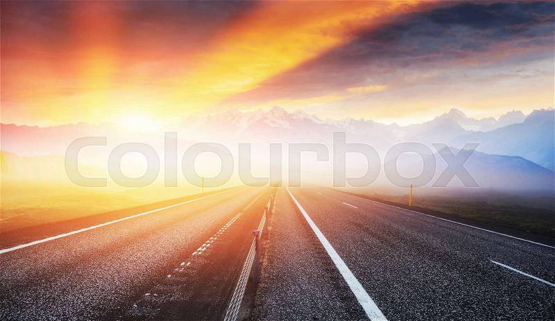 Road in mountains. Thick fog at sunset. Iceland, stock photo