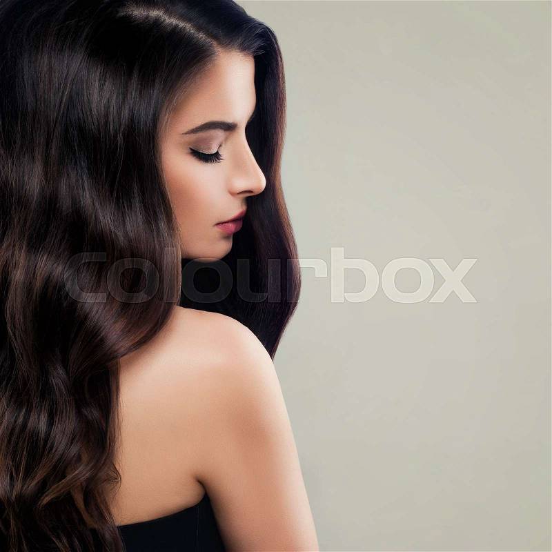 Glamorous Brunette Woman with Long Healthy Hair and Makeup. Beautiful Model, Female Profile, stock photo