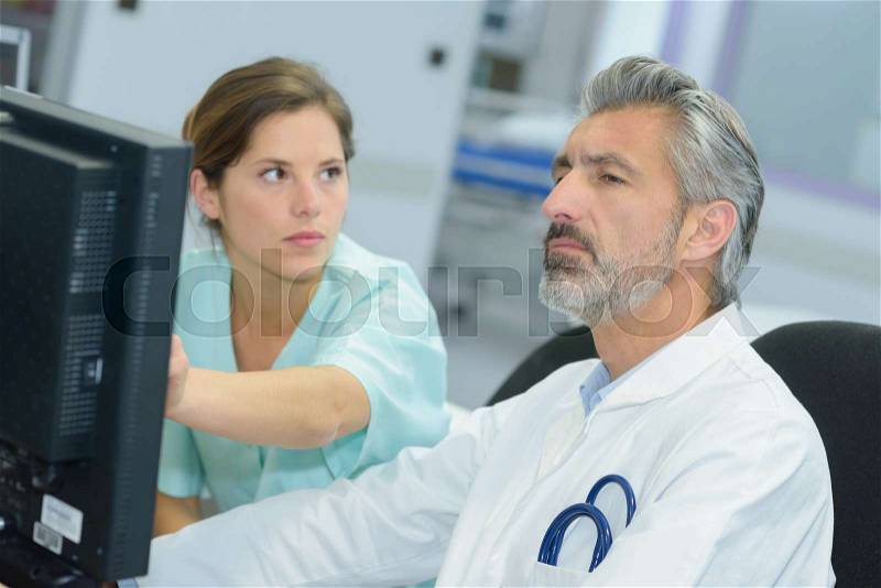 Doctor computer research, stock photo