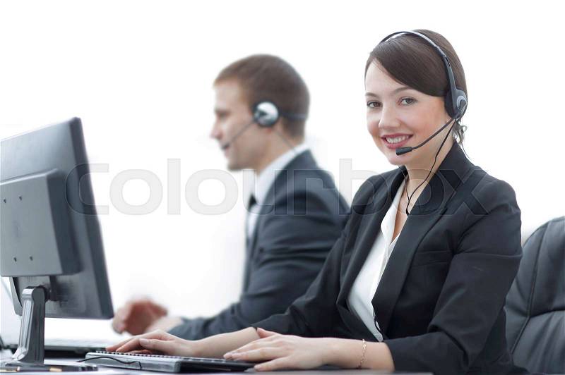 Positive Female Customer Services Agent With Headset Working In A Call Center, stock photo