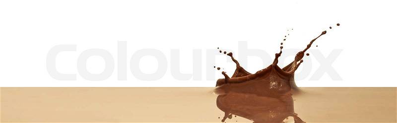 Chocolate splash closeup isolated on white background, stock photo