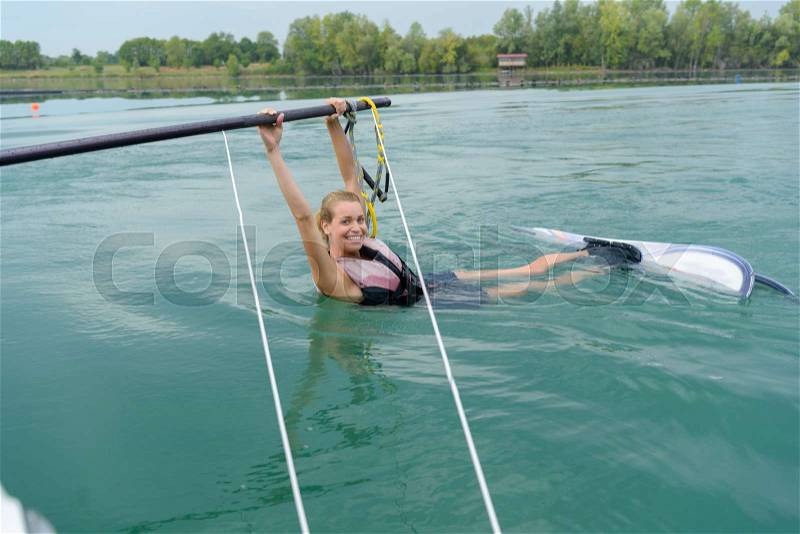 Girl on water skis in the water, stock photo