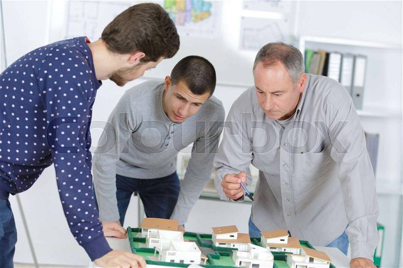 Architectural model building training students, stock photo