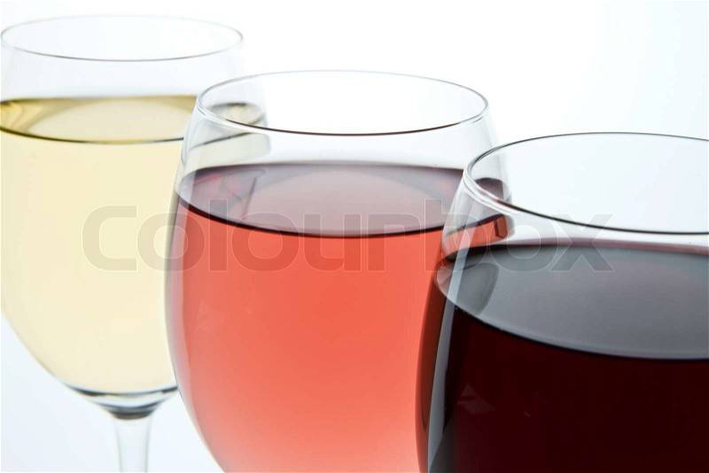Three glasses with white, rose and red wine, stock photo