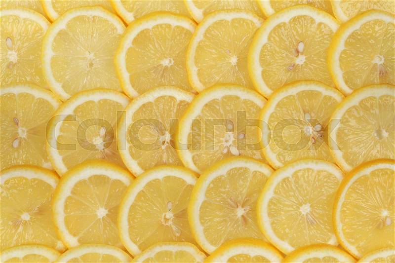 Collection of sliced lemons forming a background, stock photo