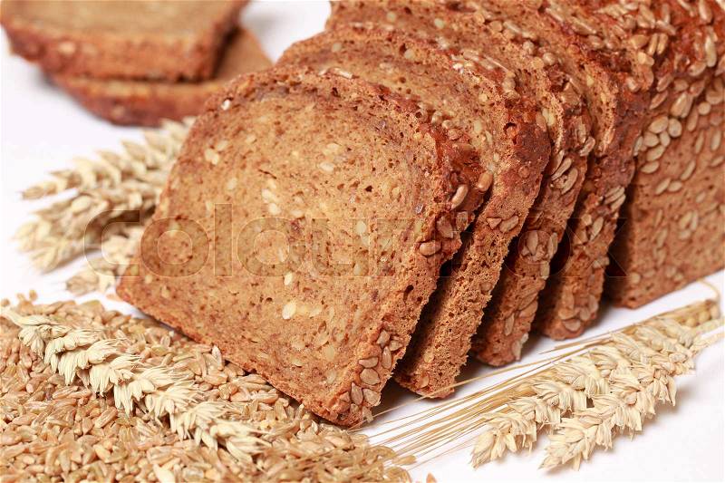Whole wheat bread cut on slices, stock photo