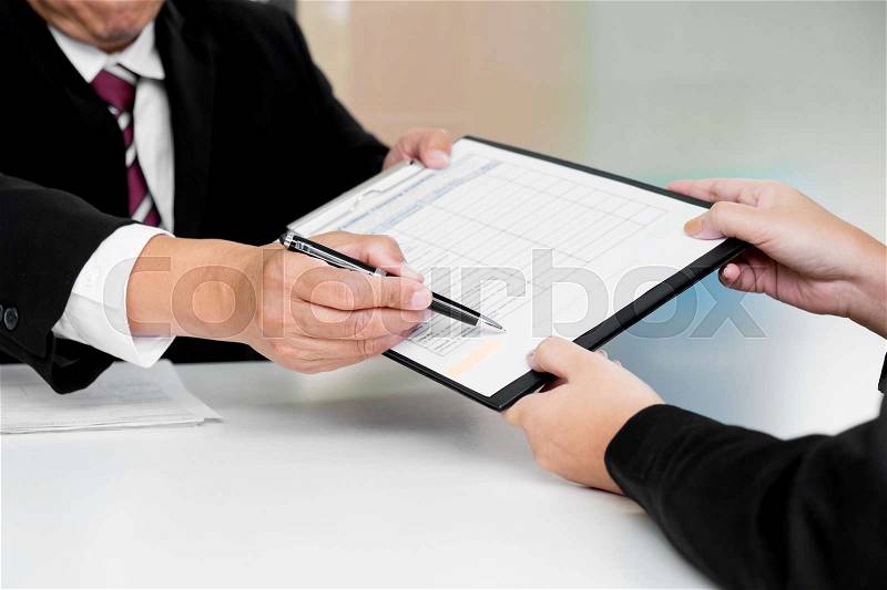Business concept - Executives at desk discussion sales performance in a office, stock photo