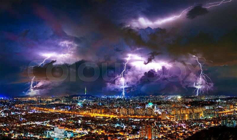 Thunderstorm clouds with lightning at night in Seoul, South Korea, stock photo