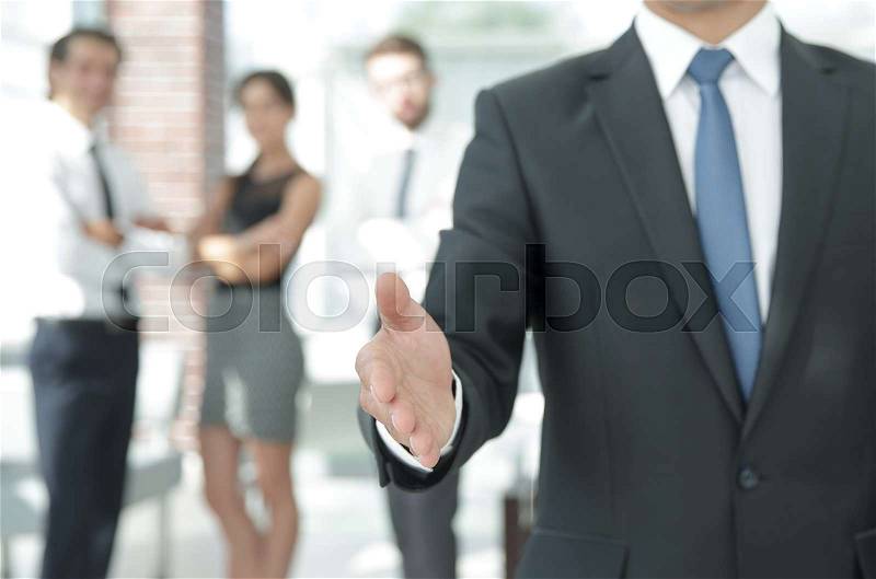 Closeup. businessman holding out hand for a handshake.the concept of partnership, stock photo