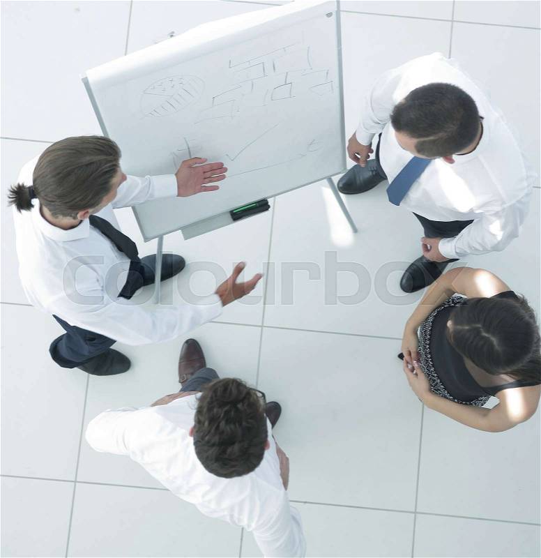 View from the top. background image of a business team discussing new ideas, standing in office hall, stock photo