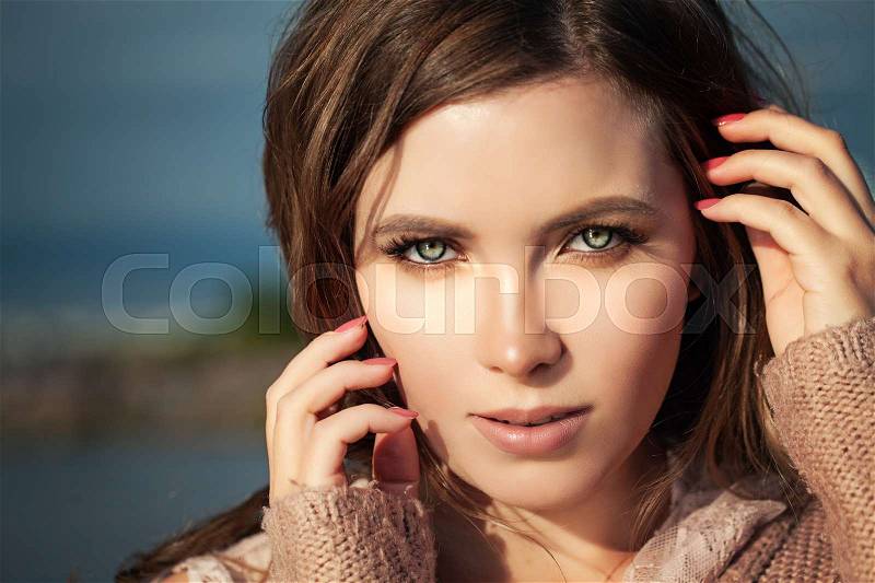 Beautiful Female Face Closeup. Woman with Natural Makeup Outdoors , stock photo