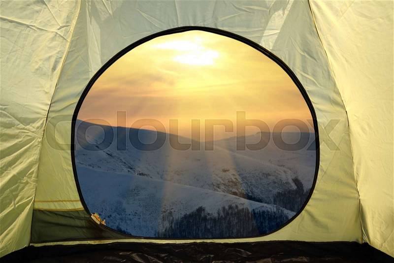 View from inside a tent on mountains landscape. Travel lifestyle concept adventure vacations outdoor, stock photo