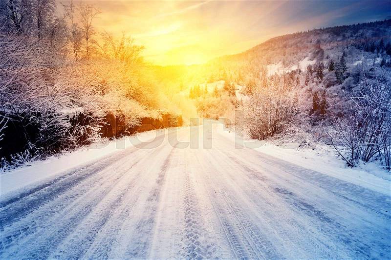 Road to the sunset in the winter mountains. Winter landscape. The concept of aspiration and movement. Toning, stock photo