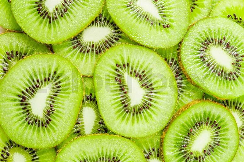 Texture of slices kiwi fruit as background, stock photo