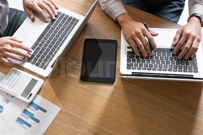 Top view of creative Team job. young business man working with startup project analyse graph plans and discuss at workspace office, Brainstorm meeting concept, stock photo