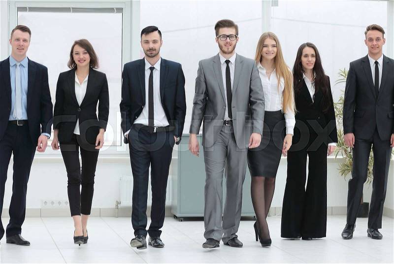 Concept of victory. business team walking forward, stock photo