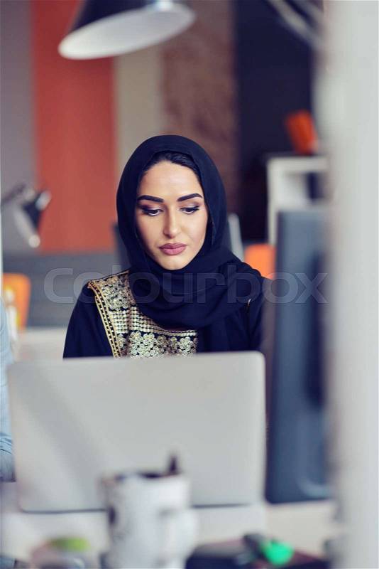 Multiracial contemporary business people working connected with technological devices like tablet and laptop, talking together - finance, business, technology concept, stock photo