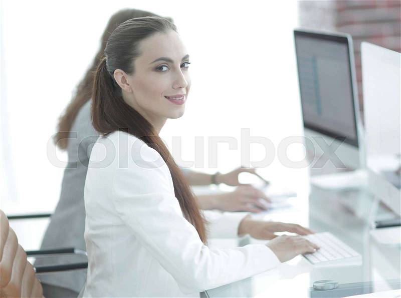 Employee of the company working at their workplace, stock photo