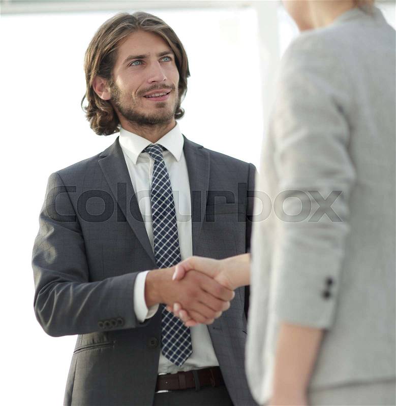 Friendly smiling business people handshaking after pleasant tal, stock photo