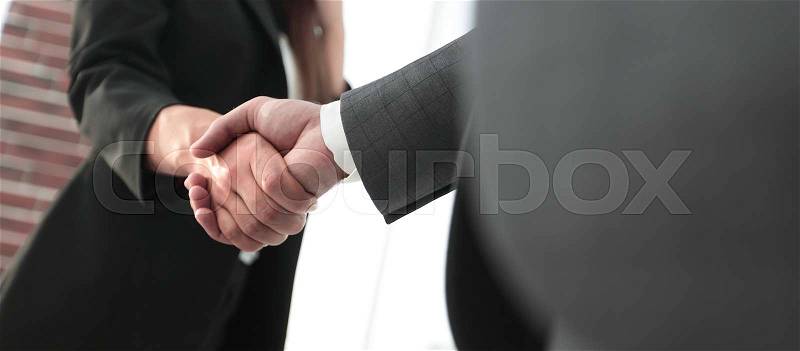 Successful business people handshaking after perfect deal, stock photo