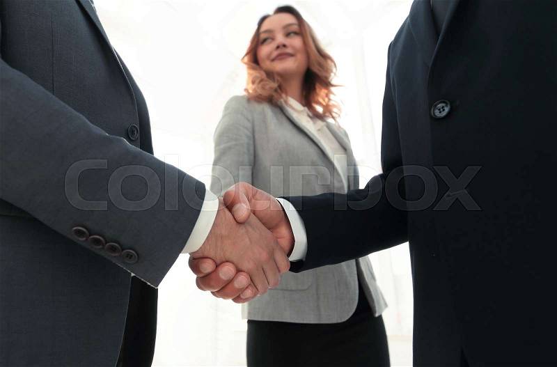 Close up business man handshake together on meeting room, stock photo