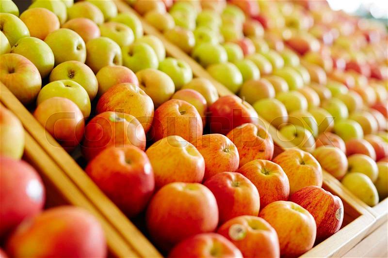 Variety of apples of different sorts in modern hypermarket, stock photo