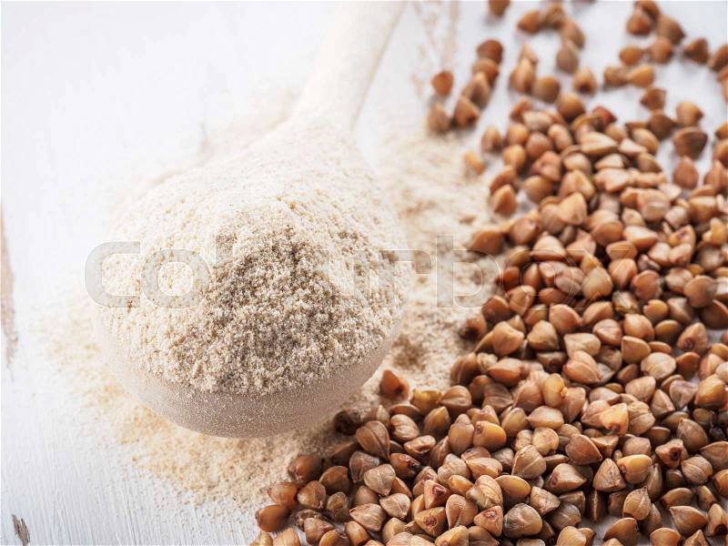 Buckwheat flour and buckwheat on white background Copy space, stock photo