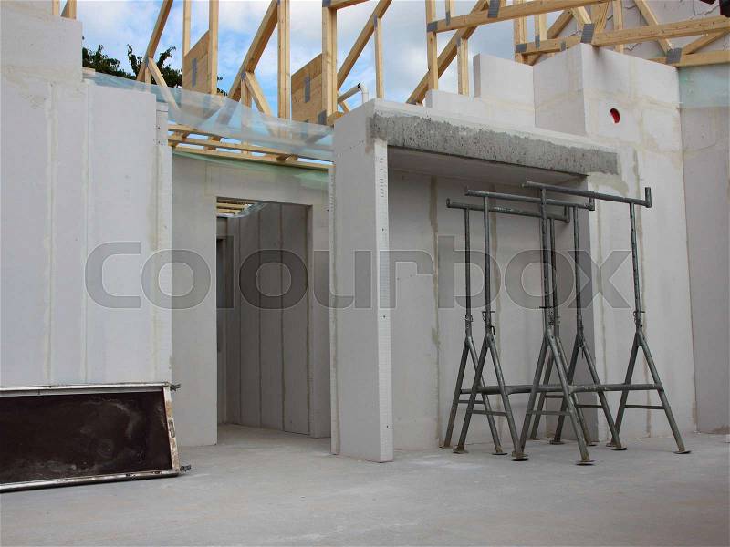 New Building Site Inside with Raw Walls open Roof, stock photo